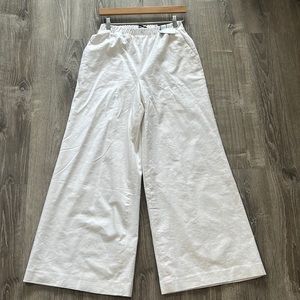 White Wide leg super high rice pants .